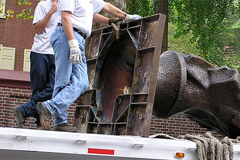 A flatbed trailed brings 'Keys To Community,' a nine-foot bronze bust of Ben Franklin for downtown Philadelphia